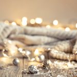 christmas background with decorative christmas trees and bokeh lights.